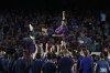 FILE - Barcelona's Jordi Alba is thrown in the air by team mates after his last home game of the season for the club at the end of a Spanish La Liga soccer match between Barcelona and Mallorca at the Camp Nou stadium in Barcelona, Spain, Sunday, May 28, 2023. Beyond being able to court and train up some of the world’s top soccer talent, Barcelona has also based its success on a strong home advantage thanks to Europe’s largest soccer stadium. That will be different this season, when the team plays at a smaller, less accessible stadium while its 99,000-seat Camp Nou undergoes a complete facelift. (AP Photo/Joan Monfort, File)