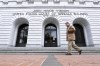 FILE - A man walks in front of the 5th U.S. Circuit Court of Appeals on Jan. 7, 2015, in New Orleans. Biden administration attorneys are set to ask appellate court judges in New Orleans on Thursday, Aug. 10, 2023, to block a Louisiana-based federal judge's broad order limiting executive branch officials and agencies' communications with social media companies about controversial online posts. The 5th Circuit granted a temporary pause on enforcement of the order on July 14, giving both sides time to file briefs and prepare for Thursday's hearing. (AP Photo/Jonathan Bachman, File)