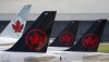 A new report says Air Canada ranked last in on-time performance among the 10 largest North American airlines. Air Canada logos are seen on the tails of planes at the airport in Montreal, Que., Monday, June 26, 2023. THE CANADIAN PRESS/Adrian Wyld