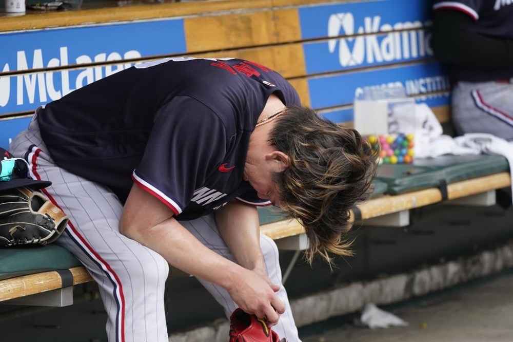 Minnesota Twins starting pitcher Kenta Maeda reflects after giving up a home run to Detroit Tigers' Riley Greene in the sixth inning of a baseball game, Thursday, Aug. 10, 2023, in Detroit. (AP Photo/Carlos Osorio)