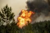 Flames from the Donnie Creek wildfire burn along a ridge top north of Fort St. John, British Columbia, Canada, Sunday, July 2, 2023. Federal officials are set to provide an update today on the outlook for this year's wildfire season.THE CANADIAN PRESS/AP, Noah Berger