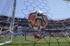 A shot by Aston Villa FC's Kansa, left, gets by Brentford FC goalkeeper Mark Flekken, center, for a goal during a Premier League Summer Series soccer match, Sunday, July 30, 2023, in Landover, Md. (AP Photo/Julio Cortez)