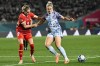 Spain's Alexia Putellas, battles for the ball with Switzerland's Julia Stierli, left, during the Women's World Cup second round soccer match between Switzerland and Spain at Eden Park in Auckland, New Zealand, Saturday, Aug. 5, 2023. (AP Photo/Andrew Cornaga)