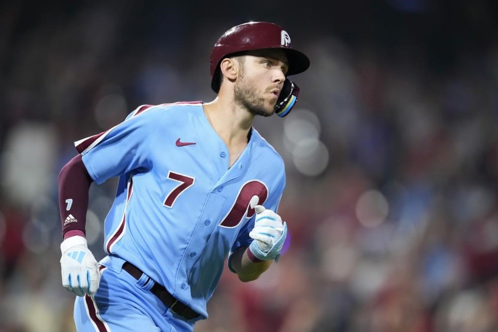 Philadelphia Phillies' Trea Turner reacts after hitting a two-tun home run against Washington Nationals pitcher Andres Machado during the sixth inning of a baseball game, Thursday, Aug. 10, 2023, in Philadelphia. (AP Photo/Matt Slocum)