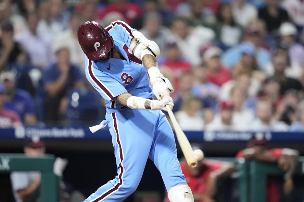 Philadelphia Phillies' Nick Castellanos hits a two-run home run against Washington Nationals pitcher Joe La Sorsa during the seventh inning of a baseball game, Thursday, Aug. 10, 2023, in Philadelphia. (AP Photo/Matt Slocum)