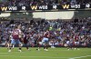 Manchester City's Erling Haaland, second left, scores their side's first goal of the game during the Premier League soccer match between Manchester City and Burnley FC at Turf Moor, Burnley, England, Friday Aug. 11, 2023. (Nigel French/PA via AP)