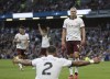 Manchester City's Erling Haaland celebrates scoring their side's second goal of the game with team-mate Kyle Walker during the Premier League soccer match between Manchester City and Burnley FC at Turf Moor, Burnley, England, Friday Aug. 11, 2023. (Nigel French/PA via AP)