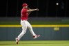 Cincinnati Reds third baseman Nick Senzel throws out Miami Marlins' Jake Burger at first base during the ninth inning of a baseball game Tuesday, Aug. 8, 2023, in Cincinnati. (AP Photo/Jeff Dean)