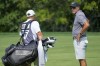 Phil Mickelson, right, talks to his caddie on the 11th hole during the Bedminster Invitational LIV Golf tournament in Bedminster, N.J., Friday, Aug. 11, 2023. (AP Photo/Mary Altaffer)