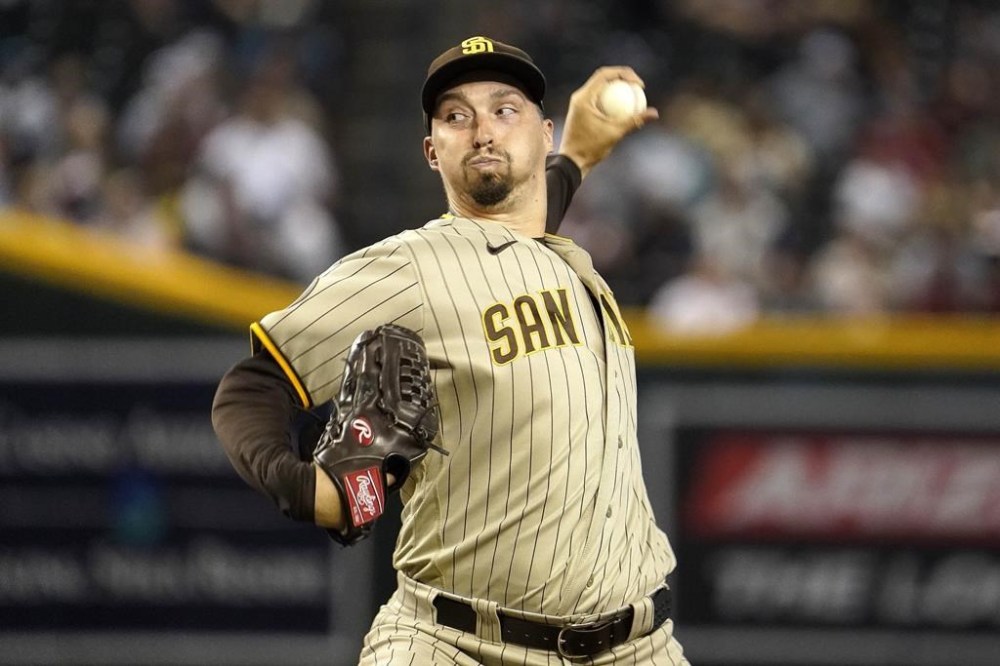 San Diego Padres pitcher Blake Snell throws to an Arizona Diamondbacks batter during the first inning of a baseball game Friday, Aug. 11, 2023, in Phoenix. (AP Photo/Darryl Webb)
