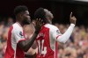 Arsenal's Eddie Nketiah, center, is cheered by teammate Arsenal's Thomas Partey after scoring during the English Premier League soccer match between Arsenal and Nottingham Forest at Emirates stadium in London, Saturday, Aug. 12, 2023. (AP Photo/Kirsty Wigglesworth)