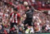 Crystal Palace's Joel Ward, right, heads the ball alongside Sheffield United's William Osula during the Premier League soccer match between Crystal Palace and Sheffield United at Bramall Lane stadium, Sheffield, England, Saturday Aug. 12, 2023. (Robbie Stephenson/PA via AP)