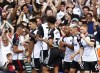 Fulham's Bobby De Cordova-Reid, third right, celebrates scoring their side's first goal of the game with team-mates during the Premier League soccer match between Everton and Fulham at Goodison Park, Liverpool, England, Saturday Aug. 12, 2023. (Richard Sellers/PA via AP)