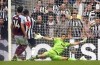 Newcastle United's Callum Wilson scores their side's fourth goal of the game during the Premier League soccer match between Newcastle United and Aston Villa at St. James' Park, Newcastle upon Tyne, England, Saturday Aug. 12, 2023. (Owen Humphreys/PA via AP)