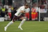 Bayern's Harry Kane enters the pitch during the German Super Cup final between FC Bayern Munich and RB Leipzig at the Allianz Arena stadium in Munich, Germany, Saturday, Aug. 12, 2023. (AP Photo/Matthias Schrader)