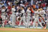 Detroit Tigers players celebrate after defeating the Boston Red Sox in a baseball game at Fenway Park, Saturday, Aug. 12, 2023, in Boston. (AP Photo/Mary Schwalm)