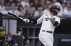 Chicago White Sox's Yoan Moncada watches his solo home run against the Milwaukee Brewers during the sixth inning of a baseball game Saturday, Aug. 12, 2023, in Chicago. (AP Photo/Paul Beaty)