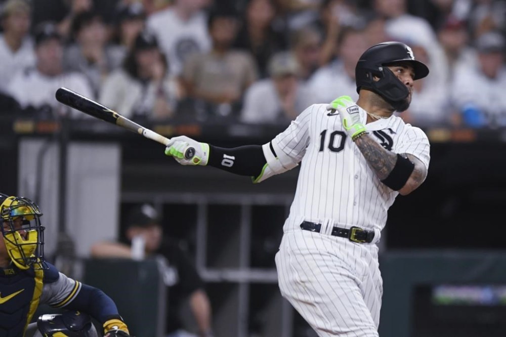 Chicago White Sox's Yoan Moncada watches his solo home run against the Milwaukee Brewers during the sixth inning of a baseball game Saturday, Aug. 12, 2023, in Chicago. (AP Photo/Paul Beaty)