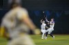 Arizona Diamondbacks' Jake McCarthy, right, catches a fly-out by San Diego Padres' Ha-Seong Kim as he avoids colliding with teammate Corbin Carroll during the third inning of a baseball game, Saturday, Aug. 12, 2023, in Phoenix. (AP Photo/Matt York)