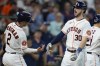 Houston Astros' Kyle Tucker (30) celebrates his three-run home run against the Los Angeles Angels with Alex Bregman during the fourth inning of a baseball game Saturday, Aug. 12, 2023, in Houston. (AP Photo/Eric Christian Smith)