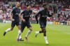 Tottenham's Emerson Royal, right, celebrates with Son Heung-min, centre and Micky van de Ven after scoring his side's second goal during an English Premier League soccer match between Brentford and Tottenham Hotspur at the Community Stadium in London, Sunday, Aug. 13, 2023. (AP Photo/Frank Augstein)