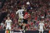 Real Madrid's Jude Bellingham, centre left, and Athletic Bilbao's Inigo Ruiz de Galarreta challenge for the ball during the Spanish La Liga soccer match between Athletic Club and Real Madrid at the San Mames stadium in Bilbao, Spain, Saturday, Aug. 12, 2023. (AP Photo/Alvaro Barrientos)