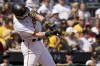 Pittsburgh Pirates' Jared Triolo hits a three-run home run against the Cincinnati Reds during the seventh inning in the first baseball game of a doubleheader in Pittsburgh, Sunday, Aug. 13, 2023. (AP Photo/Matt Freed)