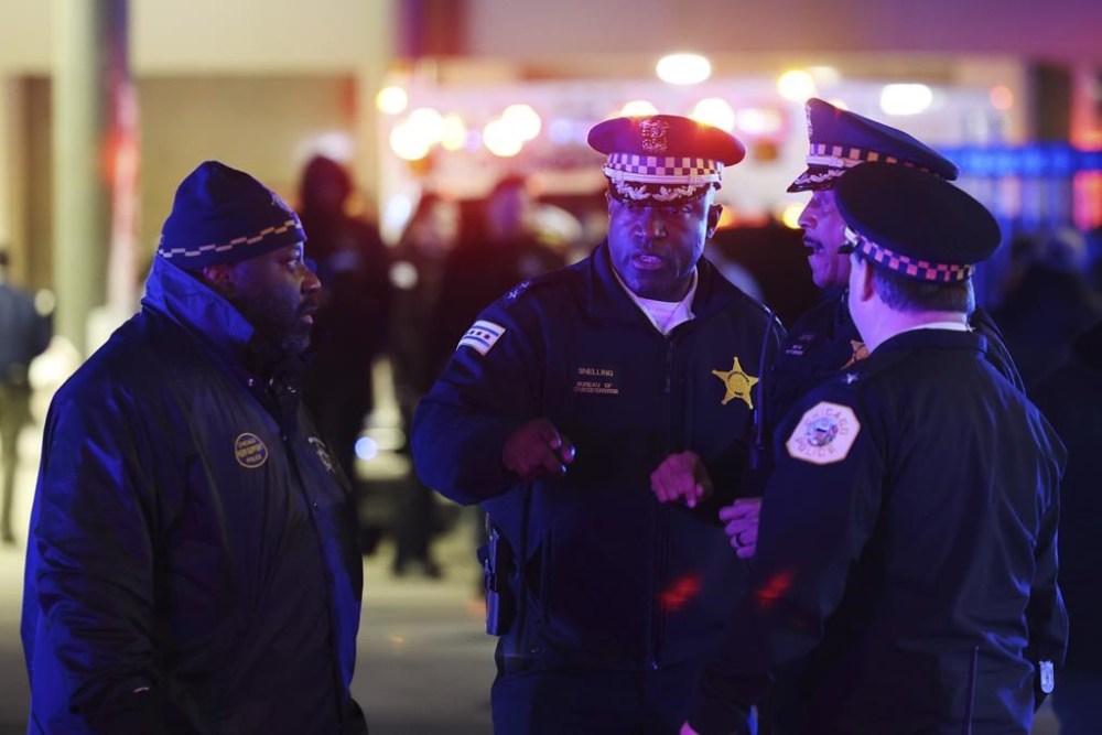 Police supervisors, including Chief of the Bureau of Counterterrorism Larry Snelling, center, prepare to have the body of a Chicago police officer transferred to the Cook County Medical Examiner on March 1, 2023, in Chicago. Chicago Mayor Brandon Johnson on Sunday, Aug. 13, 2023, named Snelling, the police department's counterterrorism head, as his choice for police superintendent of the nation's third-largest city. (John J. Kim/Chicago Sun-Times via AP)
