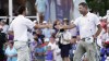 Lucas Glover, right, shakes hands with Patrick Cantlay on the 18th green after Glover won the St. Jude Championship golf tournament in a playoff Sunday, Aug. 13, 2023, in Memphis, Tenn. (AP Photo/George Walker IV)