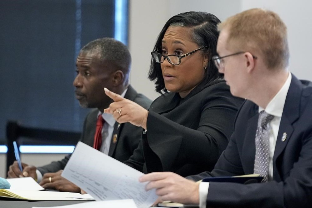 FILE - Fulton County District Attorney Fani Willis speaks in court in the Fulton county courthouse, July 11, 2023, in Atlanta. Just one month after Donald Trump’s January 2021 phone call to suggest Georgia’s secretary of state could overturn his election loss, Willis announced she was looking into possibly illegal “attempts to influence” the results. (AP Photo/Brynn Anderson, File)
