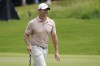 Rory McIlroy walks on the first green during the final round of the St. Jude Championship golf tournament Sunday, Aug. 13, 2023, in Memphis, Tenn. (AP Photo/George Walker IV)