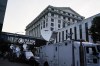 Media vehicles stage outside the Fulton County Courthouse, Monday, Aug. 14, 2023, in Atlanta. The indictment Fulton County District Attorney Fani Willis may bring as soon as this week could be the most sprawling case against former President Donald Trump. (AP Photo/Brynn Anderson)