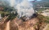 Crews worked quickly to douse flames that broke out Sunday on a hill just above Teck Resources' Trail operations, potentially threatening the work site as well as some homes near the community of Warfield, B.C. Smoke from the fire is shown in this handout from BC Wildfire Service. THE CANADIAN PRESS/HO-BC Wildfire Service **MANDATORY CREDIT **
