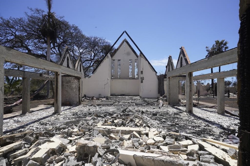 The destroyed Waiola Church is shown following wildfire, Friday, Aug. 11, 2023, in Lahaina, Hawaii. Currently, the Maui wildfires are the nation's fifth-deadliest on record, according to research by the National Fire Protection Association, a nonprofit that publishes fire codes and standards used in the U.S. and around the world. (AP Photo/Rick Bowmer)