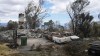 Charred vehicles sit near a wildfire-destroyed home Monday, Aug. 14, 2023, in Kula, Hawaii. The same day a wildfire ripped through Lahaina, one tore through Kula, as well. (AP Photo/Rick Bowmer)