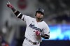 Miami Marlins' Luis Arraez celebrates as he rounds second base after hitting a home run during the eighth inning of a baseball game against the Houston Astros, Monday, Aug. 14, 2023, in Miami. (AP Photo/Wilfredo Lee)