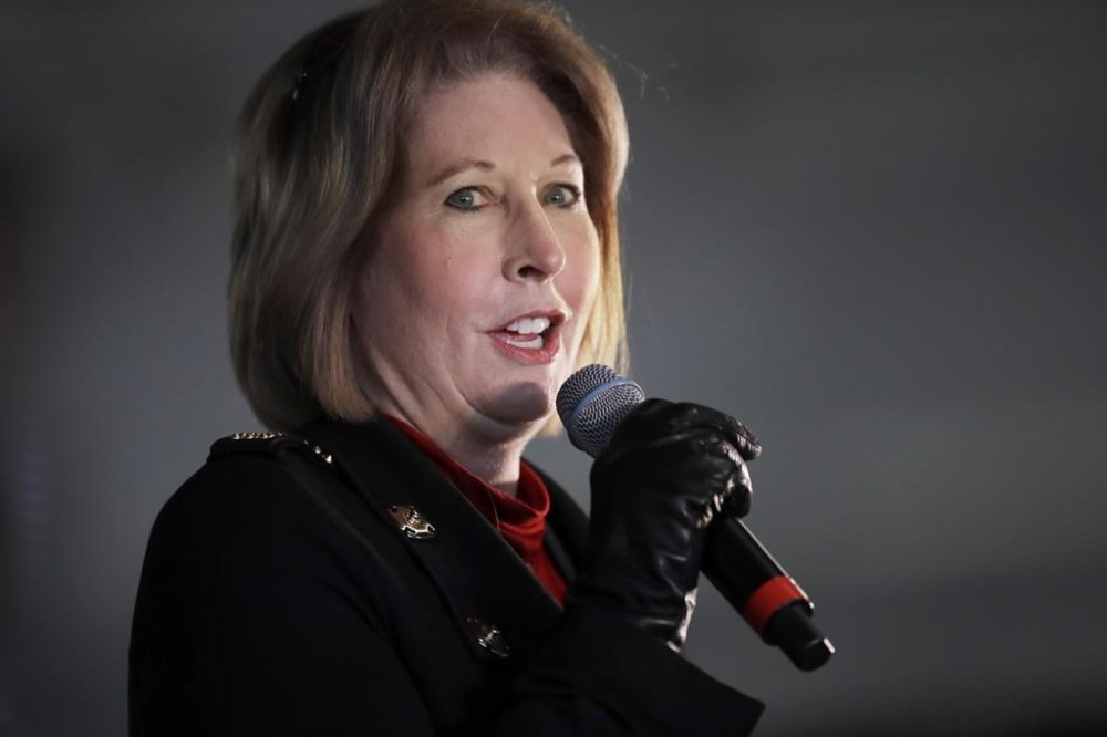 FILE - Attorney Sidney Powell, an attorney for Donald Trump, speaks during in Alpharetta, Ga., on Dec. 2, 2020. (AP Photo/Ben Margot, File)