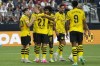 FILE - Borussia Dortmund players celebrate after Donyell Malen (21) scored against Manchester United during the first half of an international friendly soccer match Sunday, July 30, 2023, in Las Vegas. After coming so close to ending Bayern Munich’s hegemony of the Bundesliga last season, Borussia Dortmund needs to channel its disappointment into a renewed effort. But the team’s best player, Jude Bellingham, has departed for Real Madrid and Raphaël Guerreiro has switched to Bayern. It’s a tall order for their replacements to do any better. (AP Photo/John Locher, File)