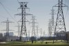 Statistics Canada says volatility in the amount Albertans paid for electricity last month helped slow the decline of Canadian energy prices for July -- one of the key reasons cited by the agency as the national inflation rate ticked up.Hydro towers are seen over a golf course in Toronto on Wednesday, Nov. 4, 2015. THE CANADIAN PRESS/Darren Calabrese