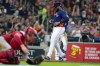 Houston Astros' Jon Singleton, right, scores a run on a wild pitch by Los Angeles Angels relief pitcher Jose Soriano during the sixth inning of a baseball game, Sunday, Aug. 13, 2023, in Houston. (AP Photo/Eric Christian Smith)