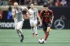 Atlanta United midfielder Thiago Almada, right, drives past Toronto FC midfielder Michael Bradley, left, during the second half of an MLS soccer match, Saturday, March 4, 2023, in Atlanta. THE CANADIAN PRESS/AP-Alex Slitz