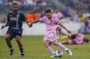 Inter Miami's Lionel Messi, right, kicks the ball for a goal next to Philadelphia Union's Jose Martinez, left, during the first half of a Leagues Cup soccer semifinal Tuesday, Aug. 15, 2023, in Chester, Pa. (AP Photo/Chris Szagola)