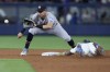 Miami Marlins' Jazz Chisholm Jr. steals second base as Houston Astros second baseman Mauricio Dubon waits for the throw during the fourth inning of a baseball game, Tuesday, Aug. 15, 2023, in Miami. (AP Photo/Wilfredo Lee)