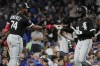 Chicago White Sox's Luis Robert Jr., right, celebrates with Eloy Jimenez after hitting a solo home run against the Chicago Cubs during the seventh inning of a baseball game in Chicago, Tuesday, Aug. 15, 2023. (AP Photo/Nam Y. Huh)