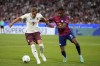 FILE - Leipzig's Mohamed Simakan, right, challenges Bayern's Harry Kane during the German Super Cup final between FC Bayern Munich and RB Leipzig at the Allianz Arena stadium in Munich, Germany, on Aug. 12, 2023. Bayern Munich has 11 Bundesliga titles in a row and a 12th in its sights. Anything else but a first career league title for new signing Harry Kane would be a monumental failure. (AP Photo/Matthias Schrader, File)