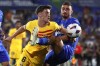 Barcelona's Gavi, left, and Getafe's Juan Iglesias challenge for the ball during the Spanish La Liga soccer match between Getafe and FC Barcelona at the Coliseum Alfonso Perez stadium in Getafe, Spain, Sunday, Aug. 13, 2023. (AP Photo/Alvaro Medranda