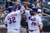 New York Mets' DJ Stewart (29) and Daniel Vogelbach (32) celebrate after scoring off of Stewart's two-run home run during the fifth inning of a baseball game against the Pittsburgh Pirates, Wednesday, Aug. 16, 2023, in New York. (AP Photo/Mary Altaffer)