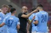 Manchester City's head coach Pep Guardiola gives instructions to his players during the UEFA Super Cup Final soccer match between Manchester City and Sevilla at Georgios Karaiskakis stadium in Piraeus port, near Athens, Greece, Wednesday, Aug. 16, 2023. (AP Photo/Thanassis Stavrakis)