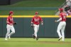 Cincinnati Reds' TJ Friedl (29) celebrates with Will Benson (30) and Stuart Fairchild (17) after catching a fly ball hit by Cleveland Guardians' Ramon Laureano during the third inning of a baseball game in Cincinnati, Wednesday, Aug. 16, 2023. (AP Photo/Jeff Dean)