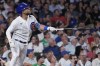 Chicago Cubs' Nick Madrigal watches his solo home run during the eighth inning of a baseball game against the Chicago White Sox in Chicago, Wednesday, Aug. 16, 2023. (AP Photo/Nam Y. Huh)